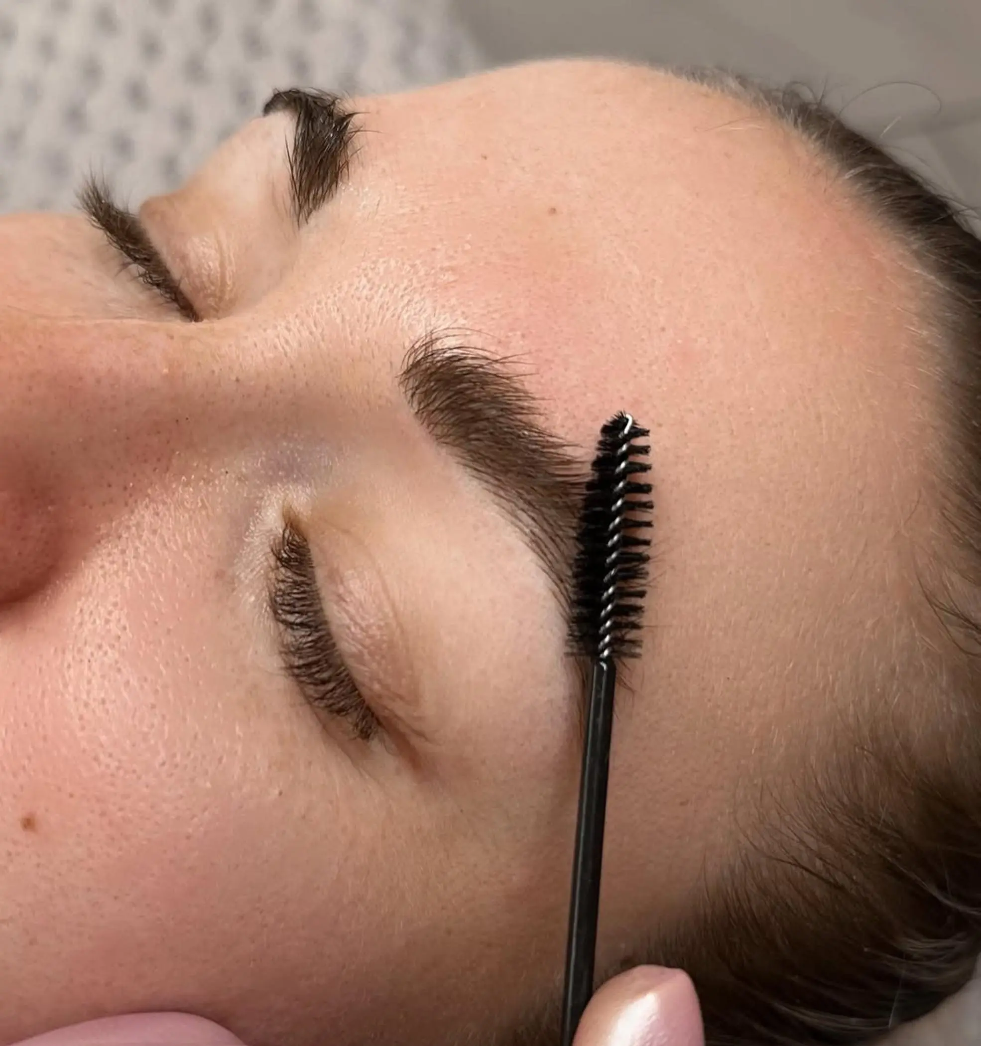 close up healed eyebrow tattoo ash purple tone