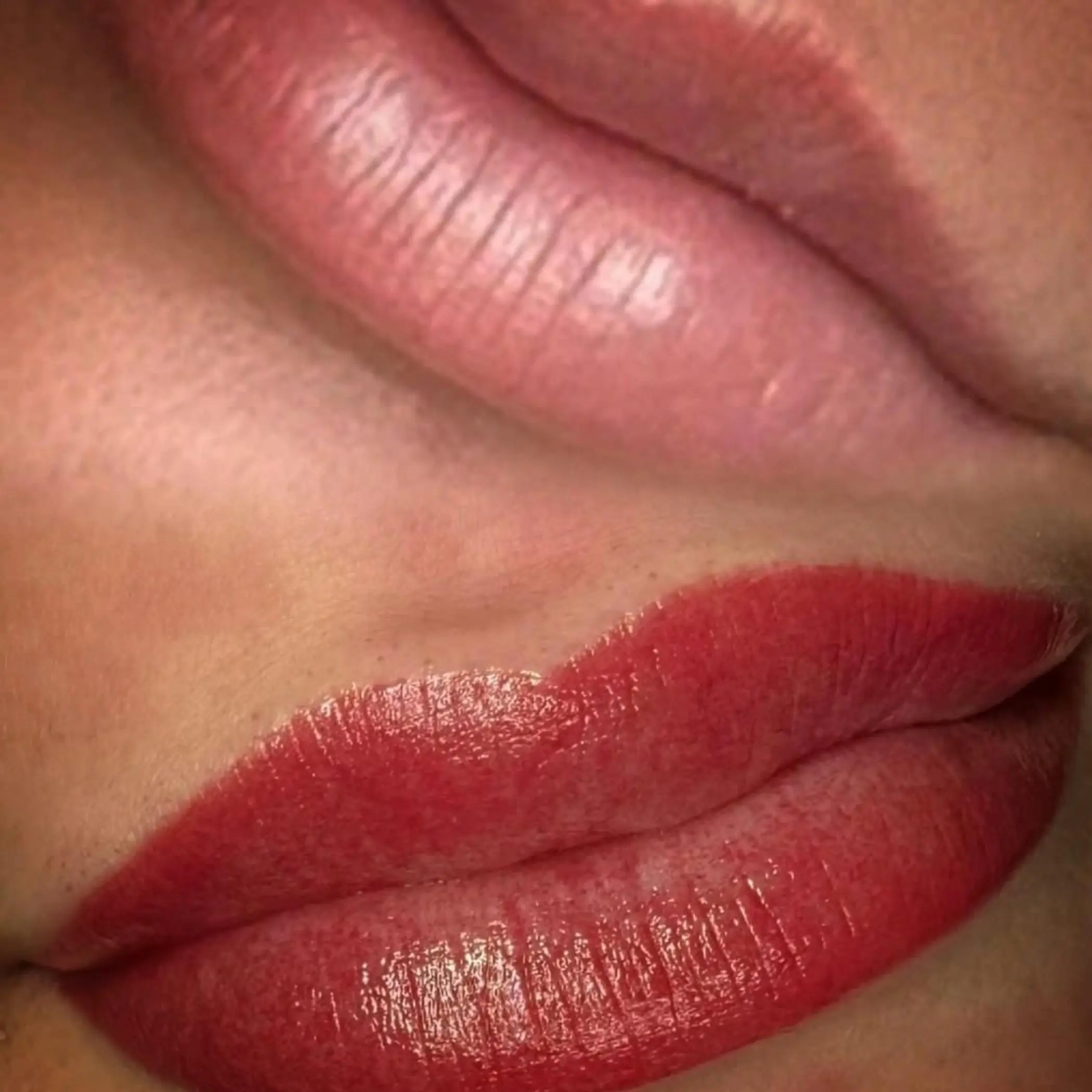 experienced technician applying lip tattoo